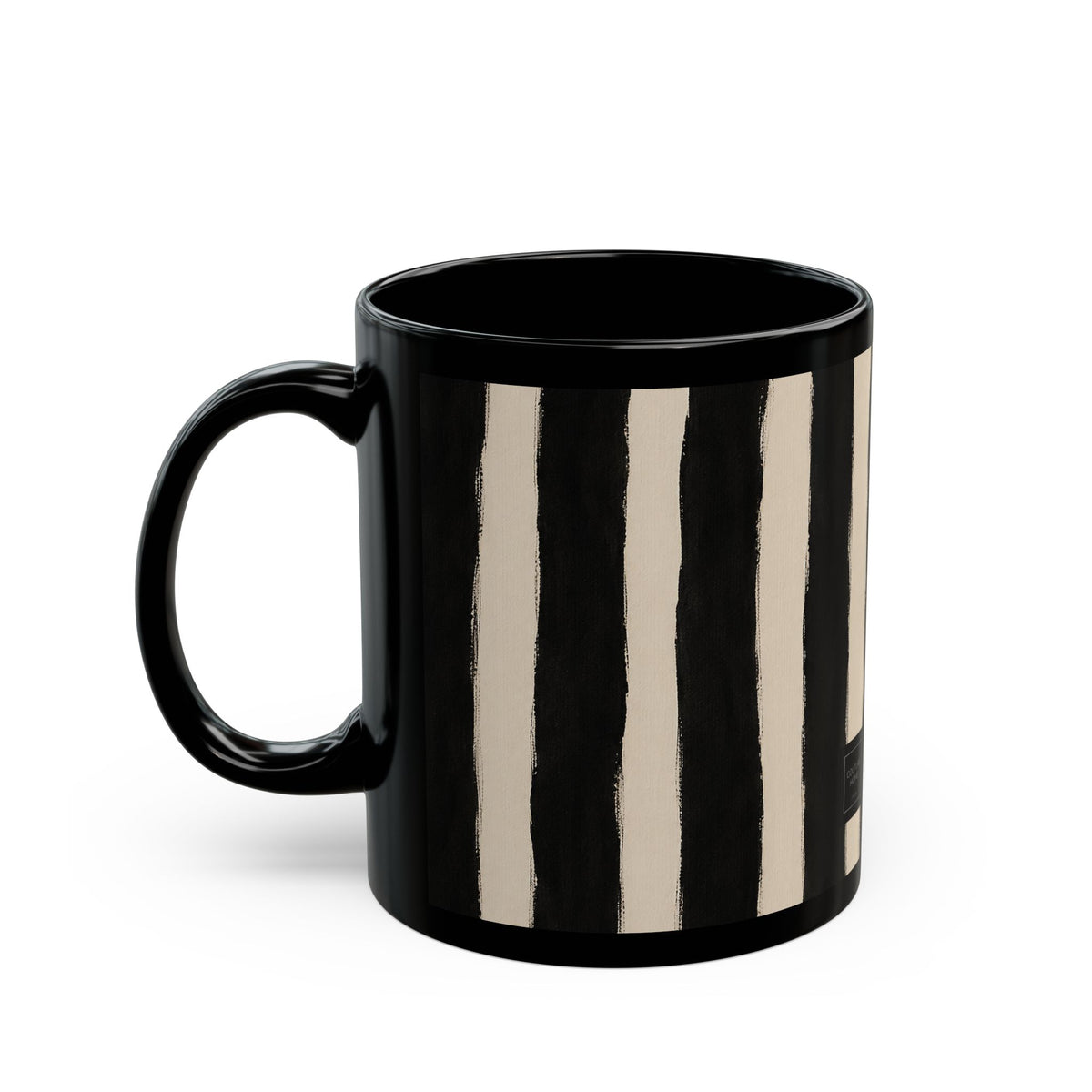 A glossy black ceramic mug featuring vertical hand-painted style stripes in black and warm cream, shown on a clean white background.