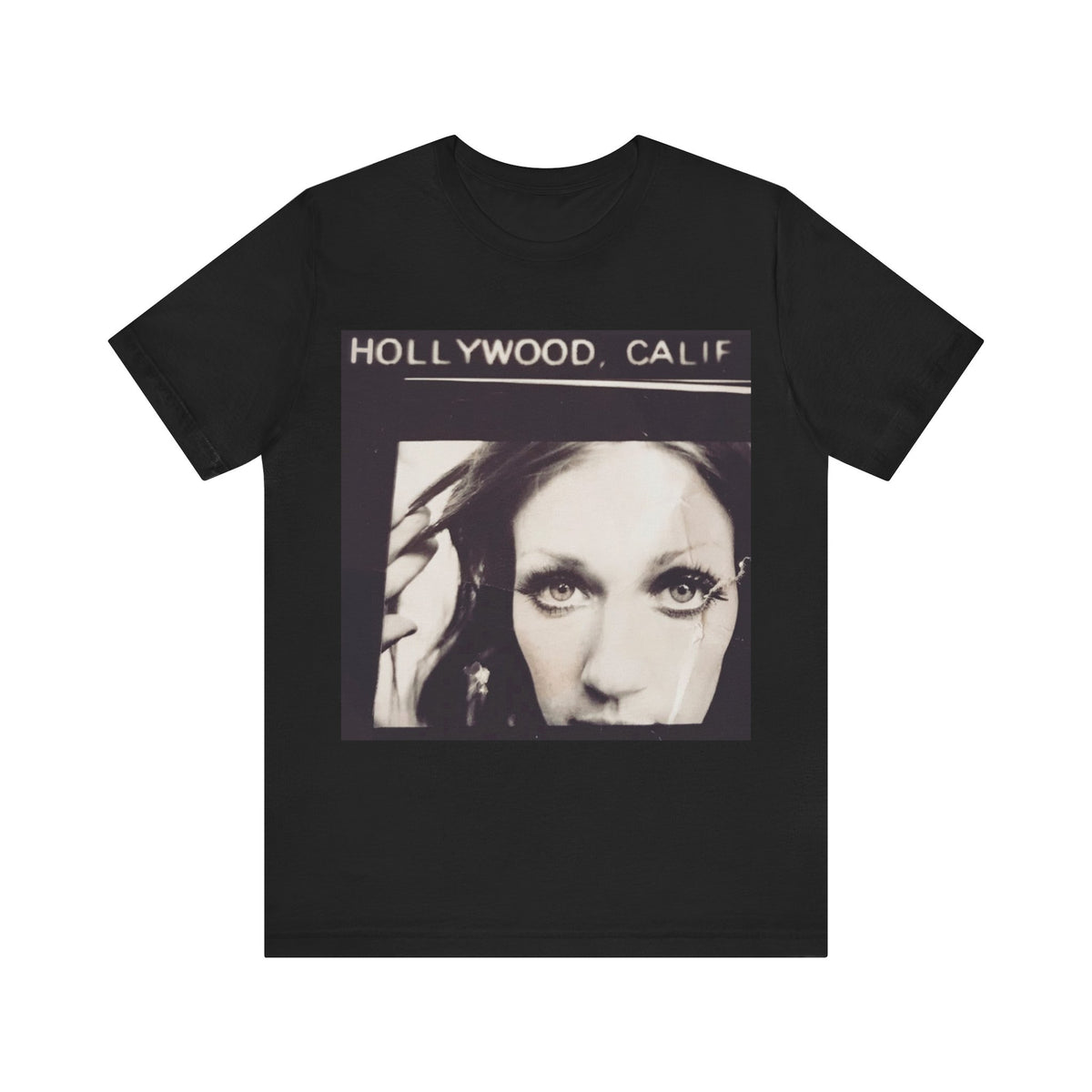 A black short-sleeve crewneck t-shirt featuring a square graphic print on the front with the text 'HOLLYWOOD, CALIF' above a black-and-white portrait of a woman.