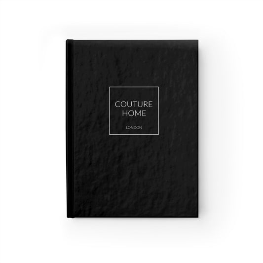 A black textured notebook with white Couture Home London logo in the centre against a white background.