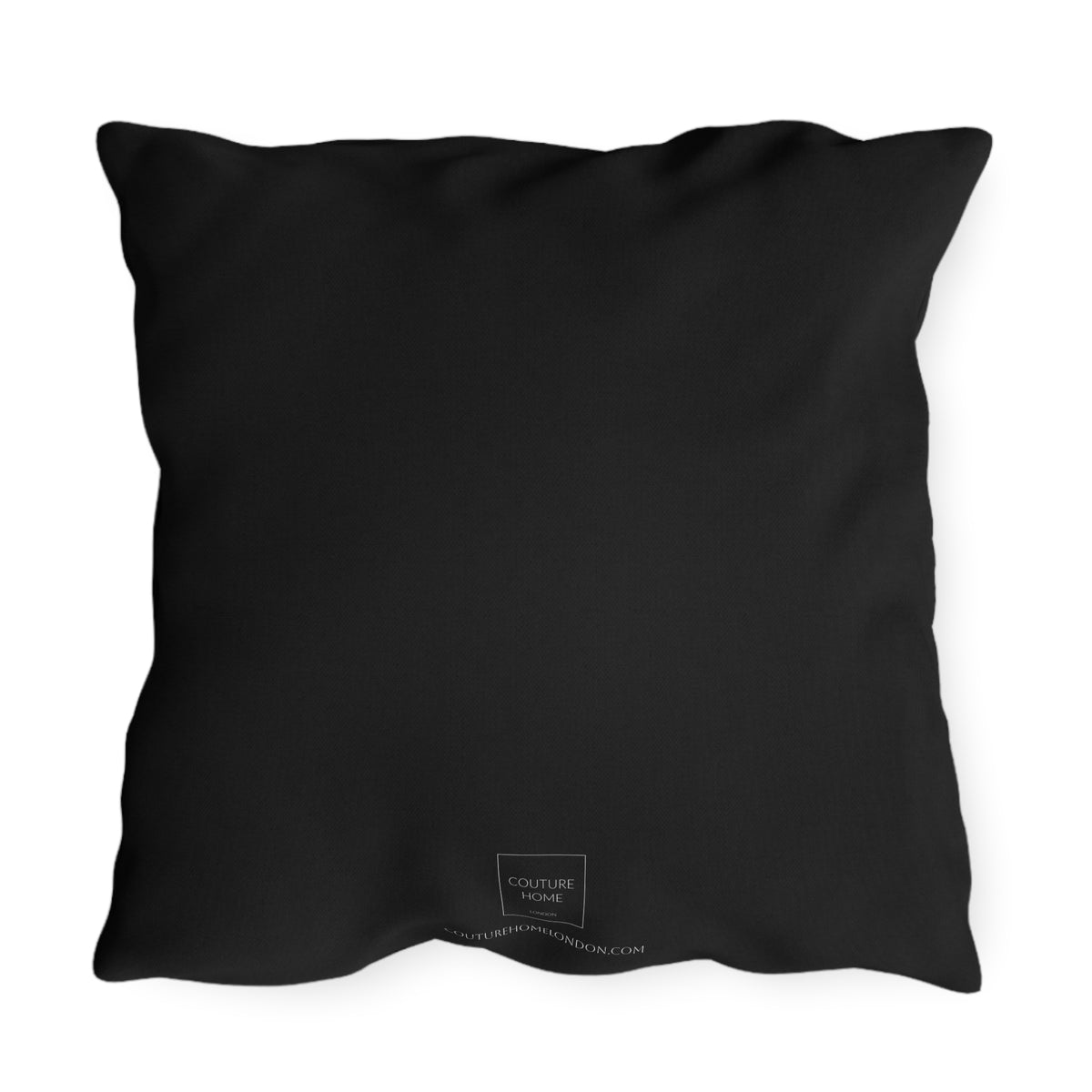 A black square throw pillow with a small white 'COUTURE HOME LONDON' logo printed near the bottom center, shown against a plain white background.