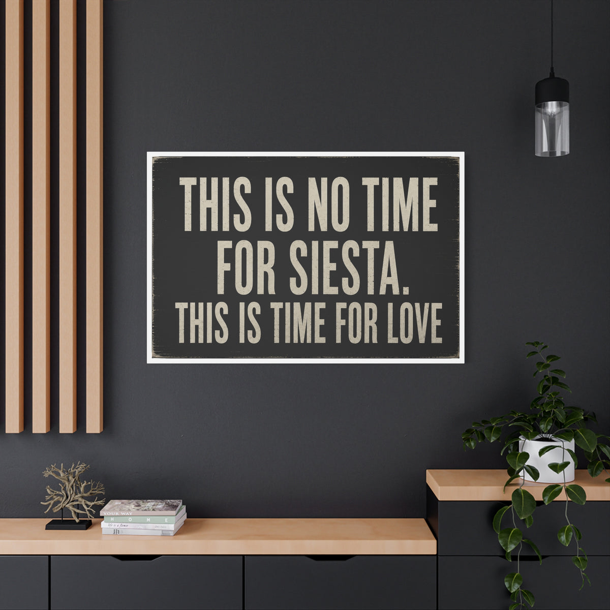 Large canvas with the text 'THIS IS NO TIME FOR SIESTA, THIS IS TIME FOR LOVE' in beige block letters on a black background.